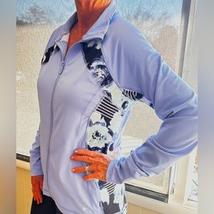 Fila jacket, zippered front, zippered side pockets, sleeve cuffs with thumb hole
